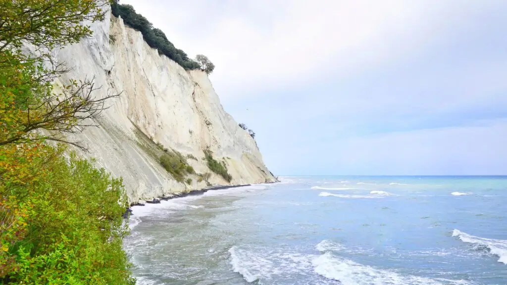 Stunning view of Møns Klint white chalk cliffs along the Baltic Sea coast in Denmark, a popular Scandinavian tourist destination.
