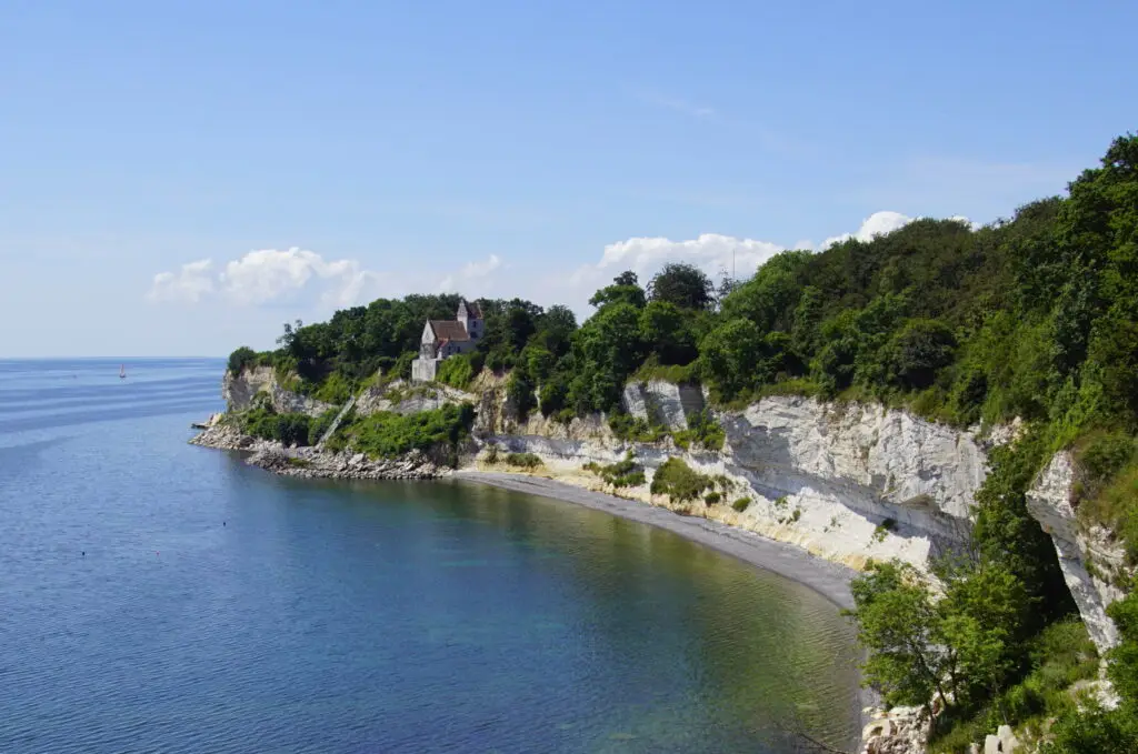 Stevns Klint UNESCO World Heritage Site, featuring stunning white chalk cliffs and pristine blue waters on Zealand Island, Denmark.