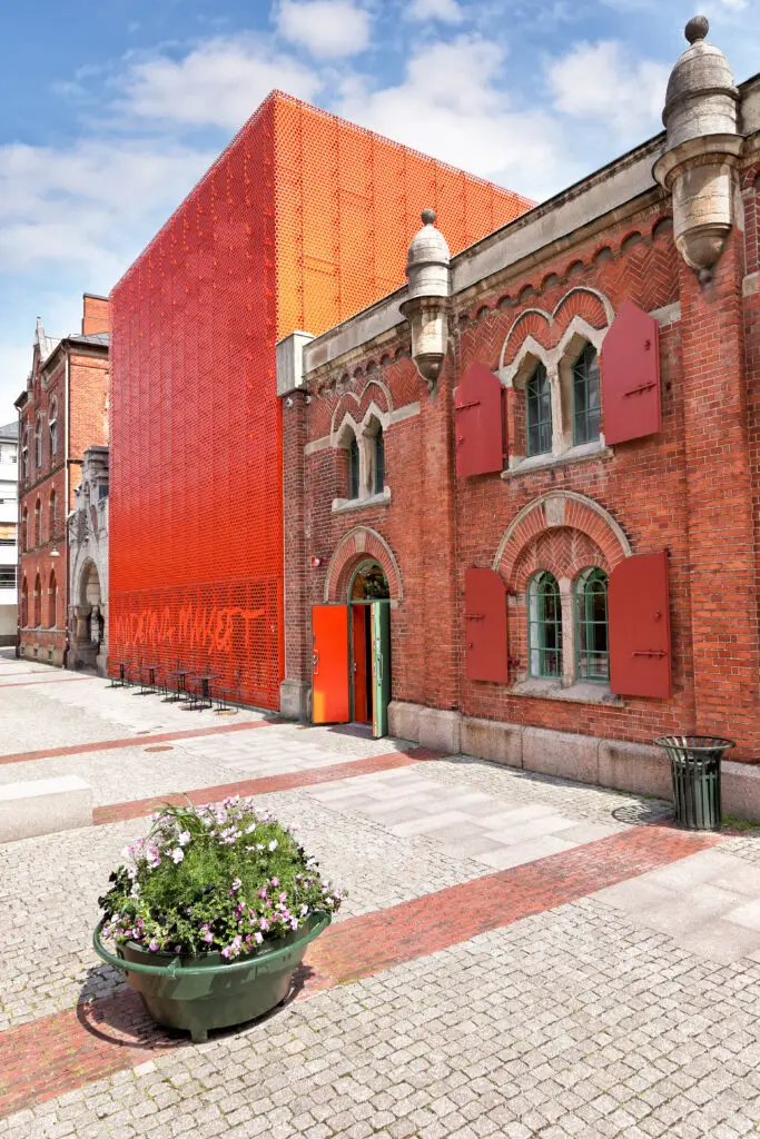 Modern Art Museum in Malmö featuring a striking red exterior and historical architecture, a popular cultural attraction in Sweden.