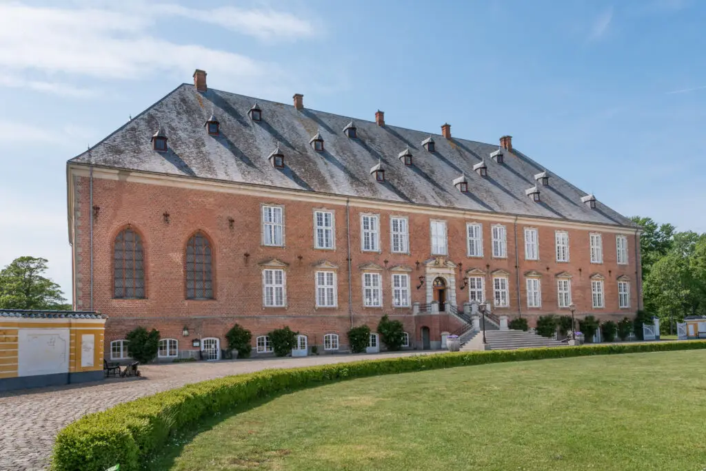 Facade of Valdemar ValdemarsCastle in Taasinge, Denmark, showcasing the historic architecture and scenic surroundings, perfect for cultural tourism in Scandinavia.