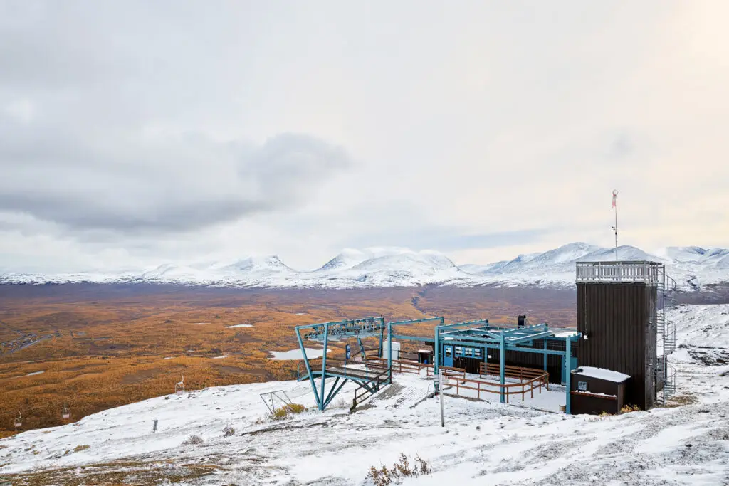 View of Aurora Sky Station on Nuolja Mountain overlooking the snowy landscape of Abisko National Park, Sweden, a popular Scandinavian tourist destination.